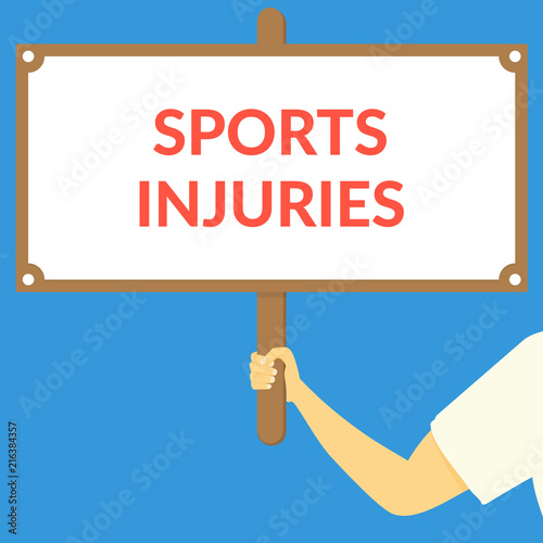 SPORTS INJURIES. Hand holding wooden sign