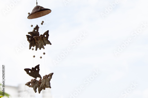 Mobile Hanging wooden butterfly under the roof to feel comfortable. photo