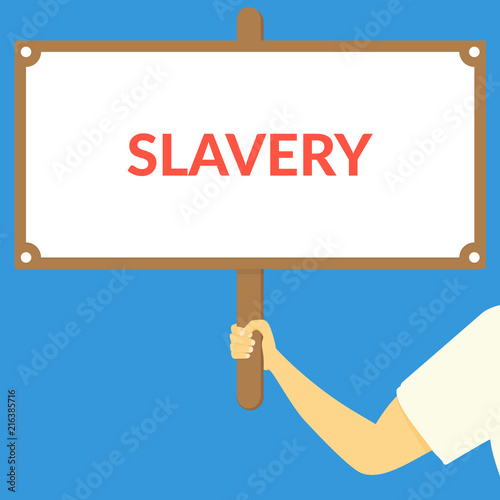 SLAVERY. Hand holding wooden sign