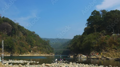 Wide shot showing border between Bangladesh and India from Piyain River photo