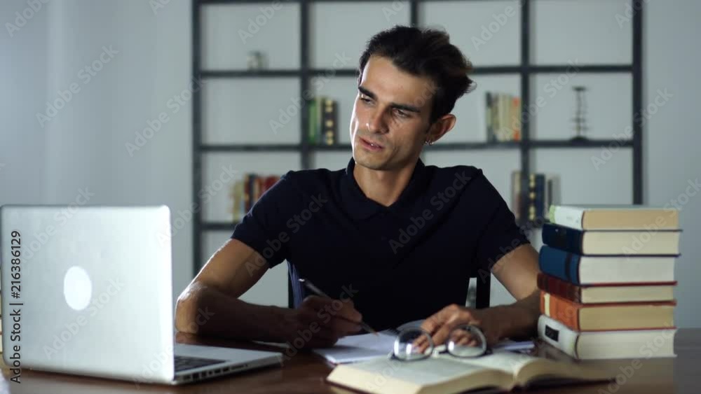 Student preparing Exam or Test in the University Library, Studying Student preparing Exam or Test in the University Library, Studying
