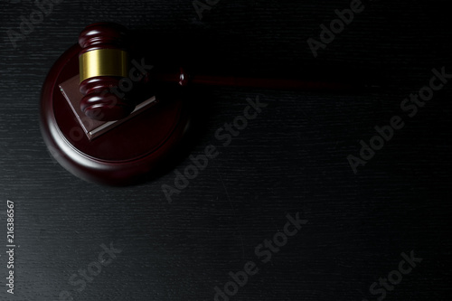 Judge gavel on black wooden background