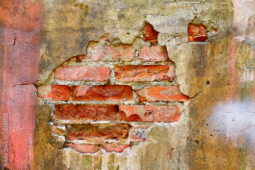 fallen off plaster, brick wall