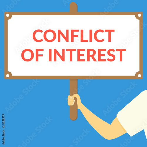 CONFLICT OF INTEREST. Hand holding wooden sign