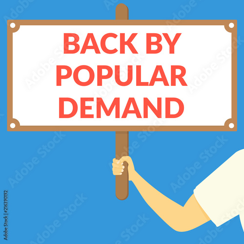 BACK BY POPULAR DEMAND. Hand holding wooden sign