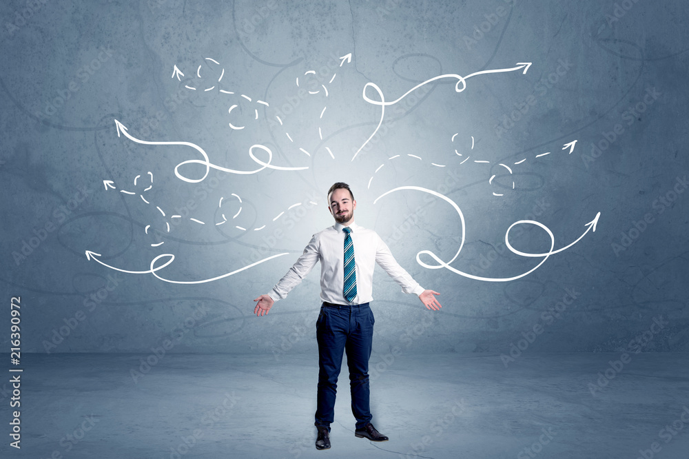 Elegant businessman choosing between directions with winding drawn arrows around
Elegant businessman choosing between directions with winding drawn arrows around
