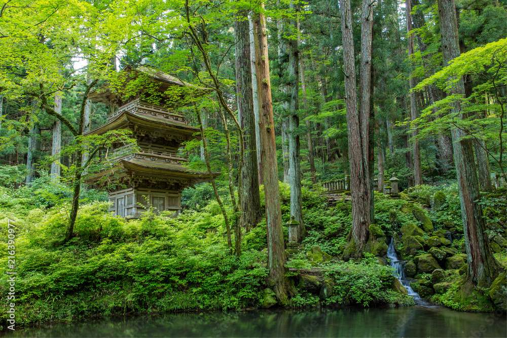 Japanese garden and a three-tiered Pagoda in the Kozenji Temple, Nagano Prefecture, Japan. Japanese garden and a three-tiered Pagoda in the Kozenji Temple, Nagano Prefecture, Japan.