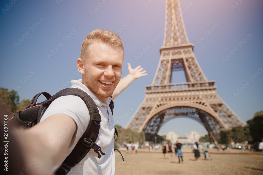 Male student doing selfie photo on background of Eiffel Tower in Paris,  France. Concept travel, training, university. Stock Photo | Adobe Stock