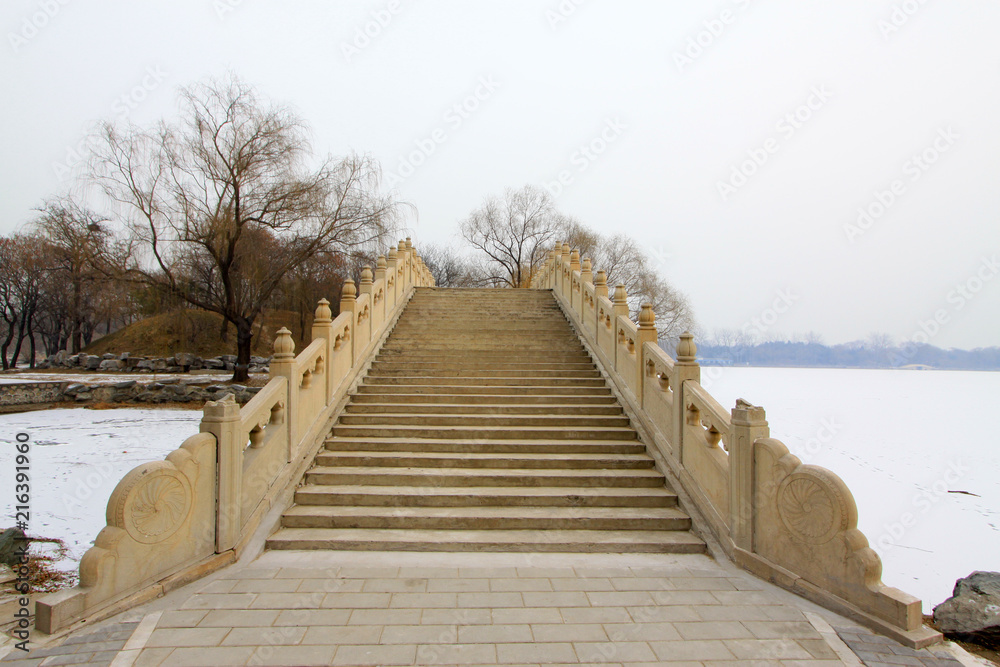 Fototapeta premium Ancient bridge in Old summer palace ruins park, Beijing, China