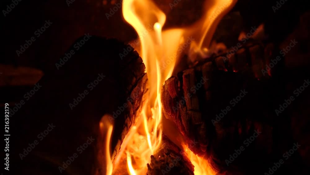 Logs burn in slow motion Logs burn in slow motion