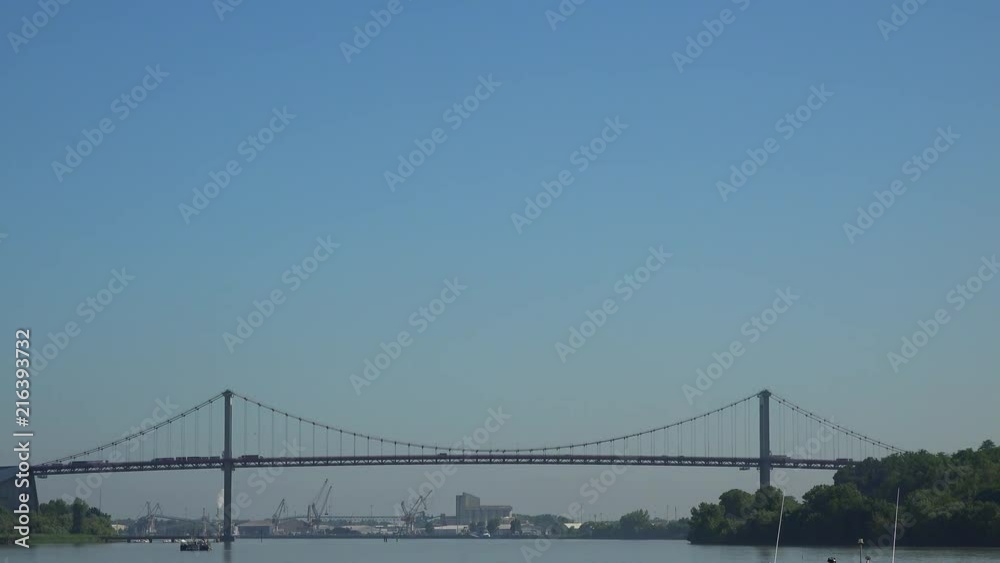 Congested traffic on highway suspension bridge over sky leading to Bordeaux City, France Congested traffic on highway suspension bridge over sky leading to Bordeaux City, France