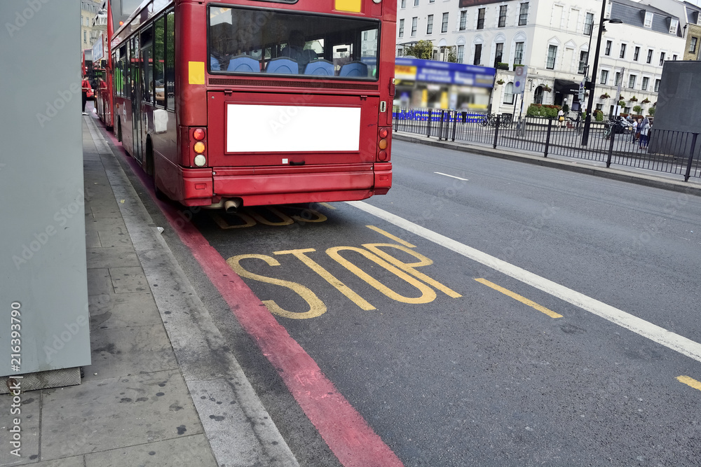 Fototapeta premium Double Decker red bus is running on road in London