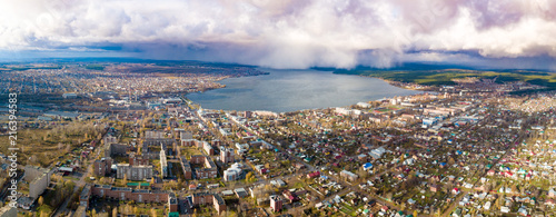 Small town and rain over lake