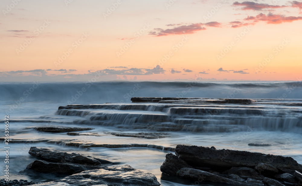 Fototapeta premium Beautiful dramatic Sunset over a rocky coast