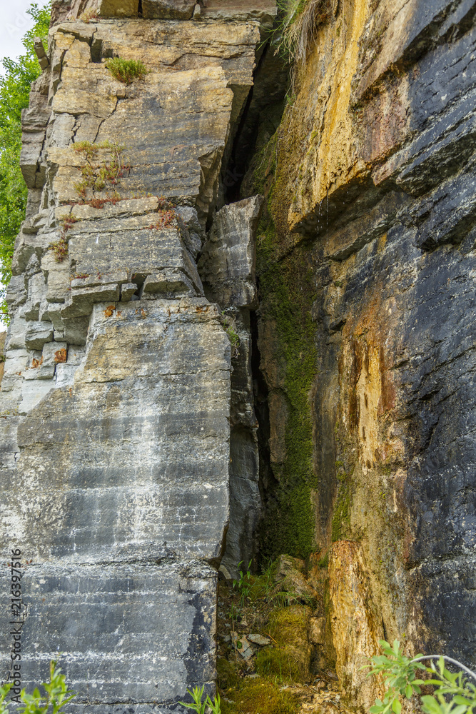 Crevice on a mountain side and dripping water