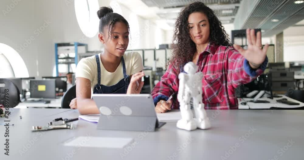 High school students working on robotics in class