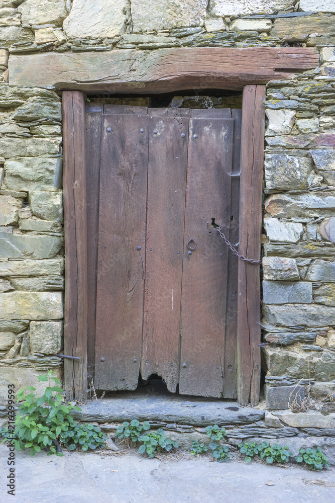 Grunge door, wood and stone houses in the province of Zamora in Spain