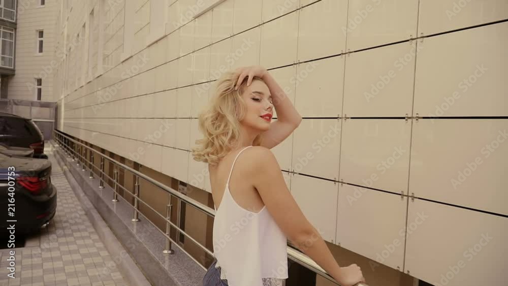 Portrait of a beautiful sexy smiling happy girl with big full lips with blond hair Portrait of a beautiful sexy smiling happy girl with big full lips with blond hair