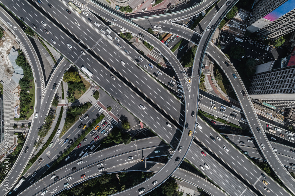 Aerial view of highway and overpass in city on sunny day Aerial view of highway and overpass in city on sunny day