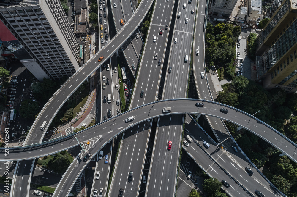 Aerial view of highway and overpass in city on sunny day Aerial view of highway and overpass in city on sunny day