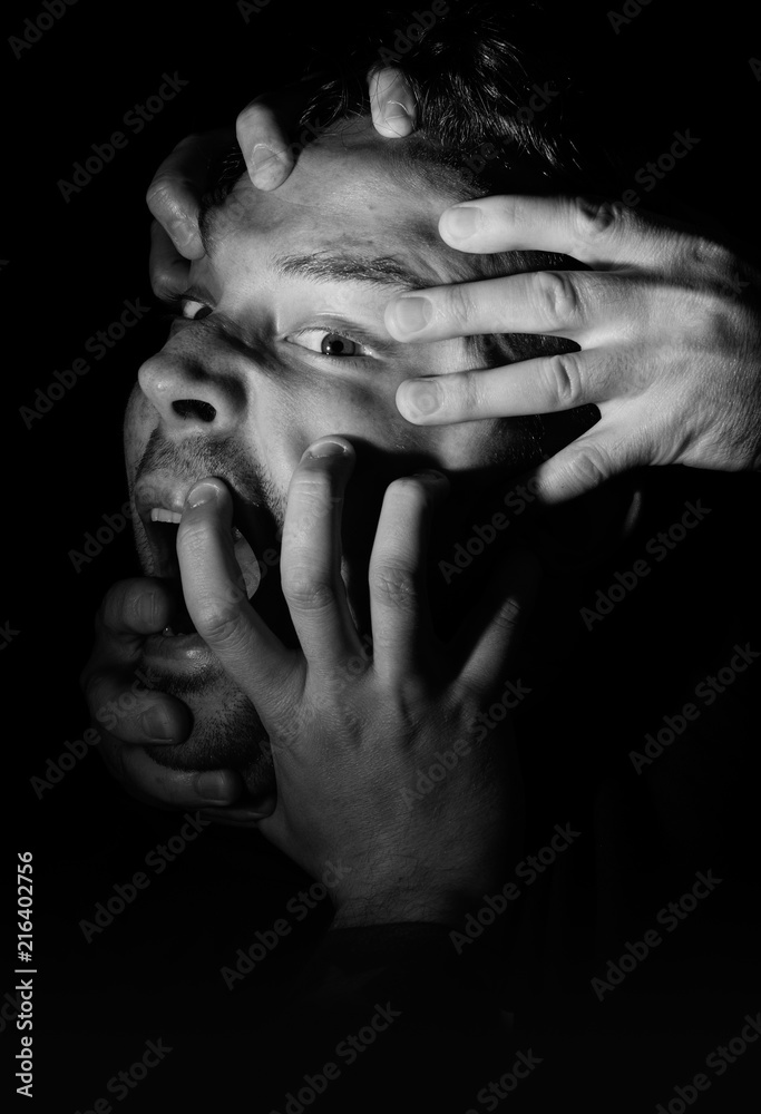 Hands Grabbing a Head in the Dark Stock Photo Adobe Stock