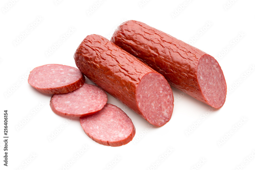 Salami smoked sausage, basil leaves on white background cutout. Salami smoked sausage, basil leaves on white background cutout.