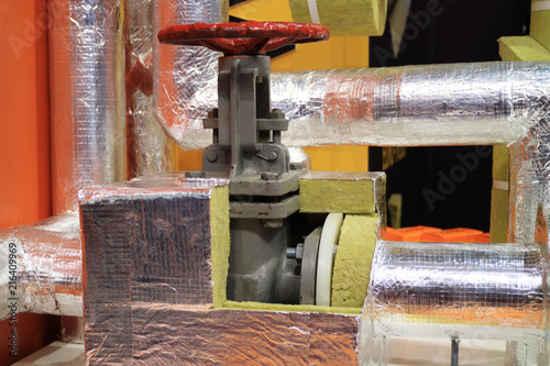 Picture of a hot water supply valve with thermal insulation.