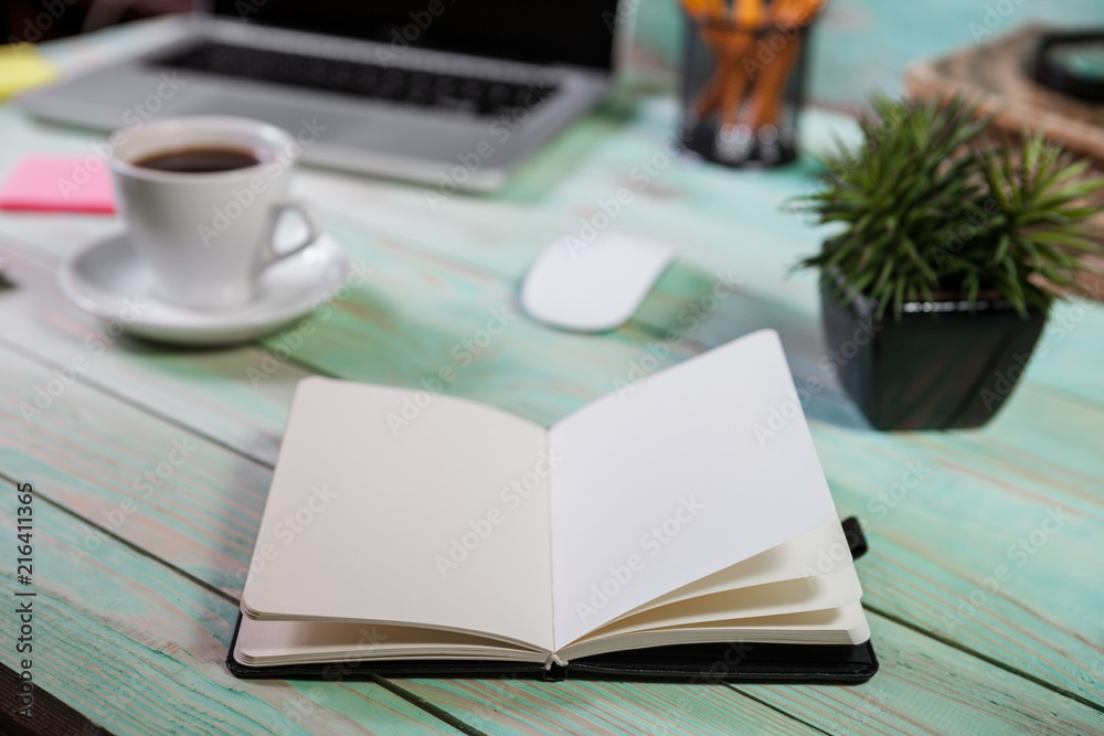 Pen and notebook with laptop.Inspiration moment,workspace or coffee break in the morning. Pen and notebook with laptop.Inspiration moment,workspace or coffee break in the morning.