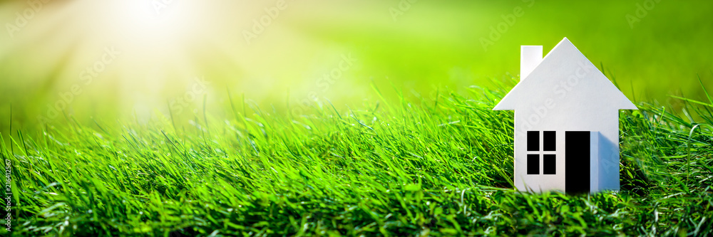 Eco Friendly House - Paper Home On Grass In Garden Eco Friendly House - Paper Home On Grass In Garden
