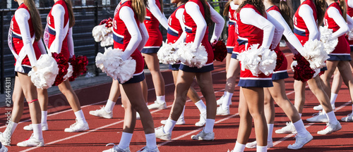 High school cheerleaders perfoming during football game