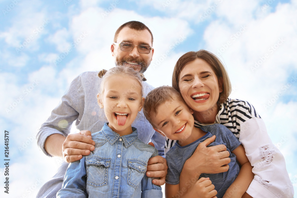 Happy family spending time together with their children outdoors Happy family spending time together with their children outdoors