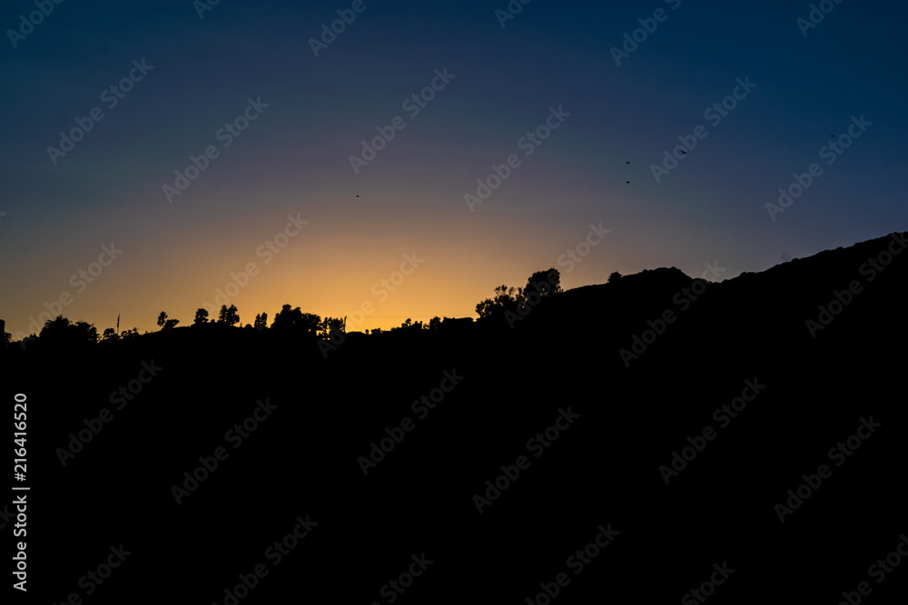 Hilltop Silhouette at Sunset