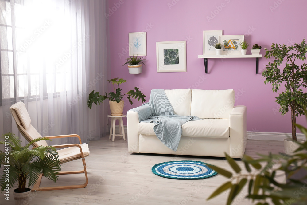 Fototapeta premium Stylish room interior with comfortable white sofa