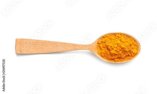 Wooden spoon with turmeric powder on white background. Different spices photo