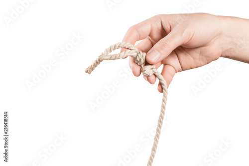 Hand holding the rope knot on white background