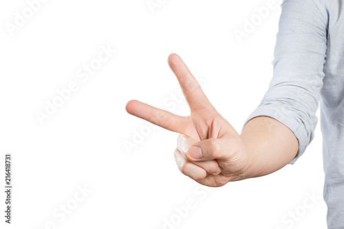 Hand showing two fingers on white background photo