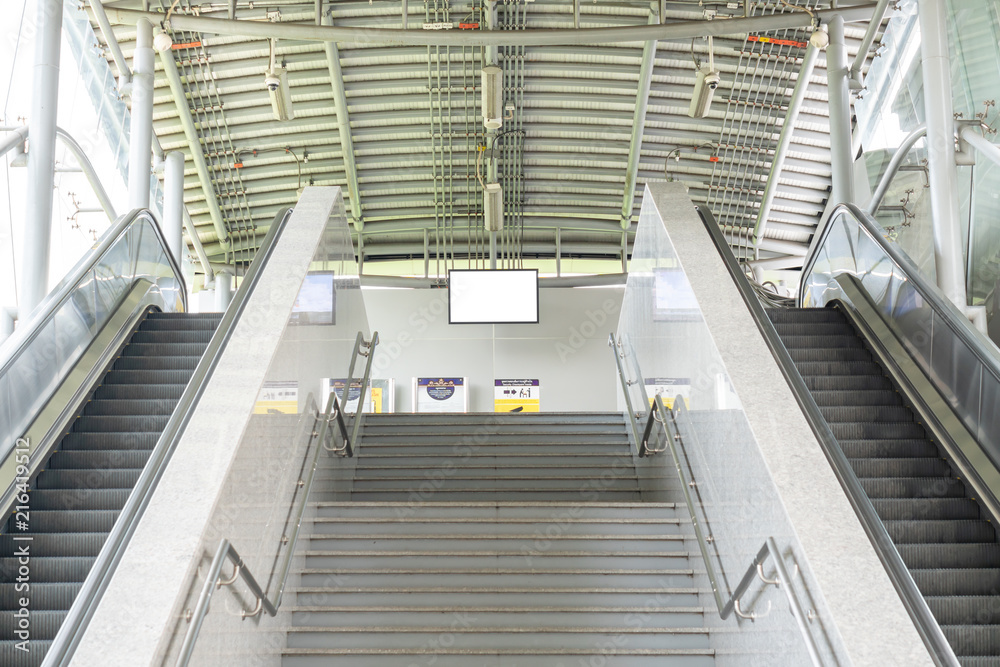 Fototapeta premium Escalator stairways to underground train station