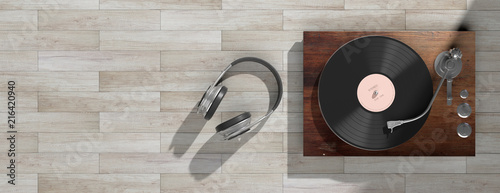 Headphones and vinyl LP record player on wooden background, banner, copy space. 3d illustration