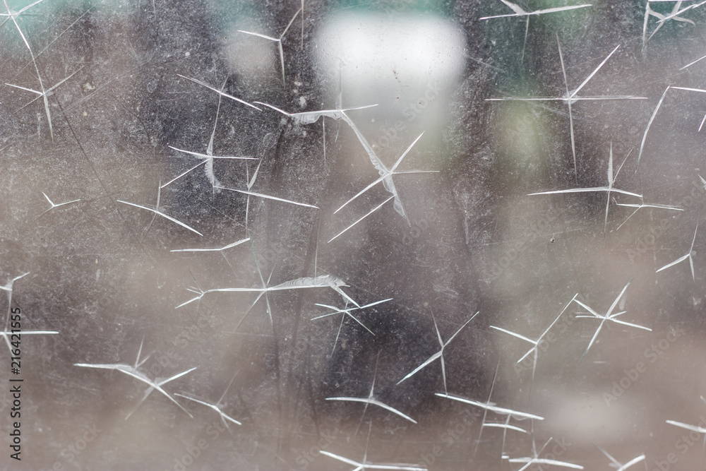 Close up of dirty scratched glass window - obrazy, fototapety, plakaty 