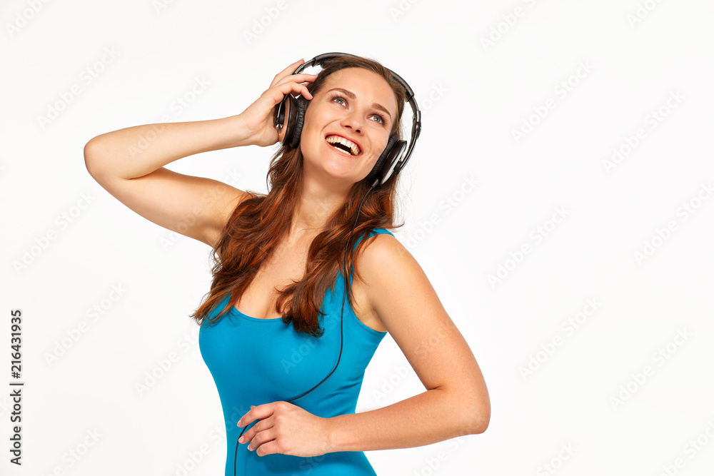 girl in headphones and blue t-shirt girl in headphones and blue t-shirt
