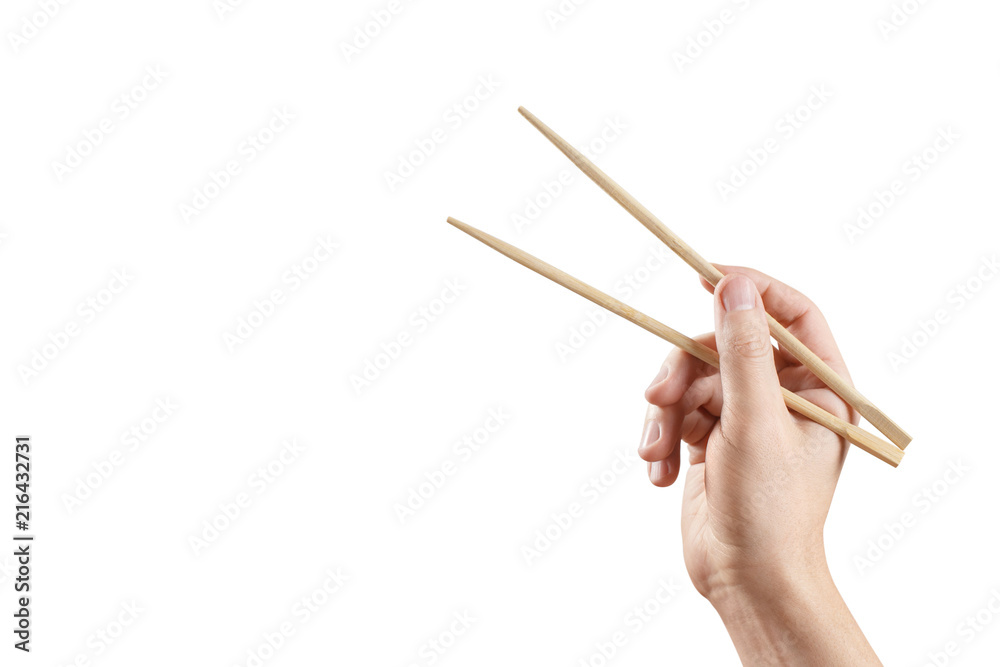 Male hand holding chopsticks, isolated on white background Male hand holding chopsticks, isolated on white background