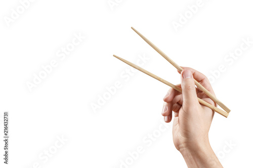 Male hand holding chopsticks, isolated on white background