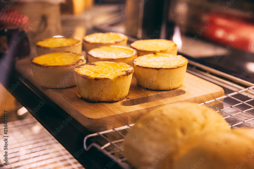 Cheese tarts on wooden plate that ready for sell. Cheese tarts on wooden plate that ready for sell.
