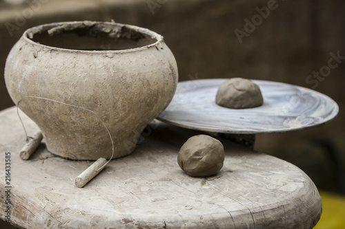 A raw clay pot in the hands of a potter. Workshop in the pottery workshop © Ingus Evertovskis