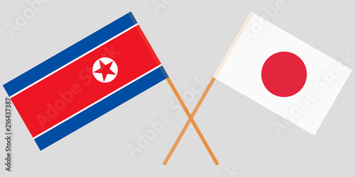 The crossed Japan and North Korea flags. Official colors. Vector