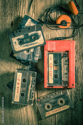 Classic audio cassette with headphones and walkman