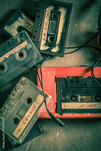 Antique audio cassette with headphones and walkman