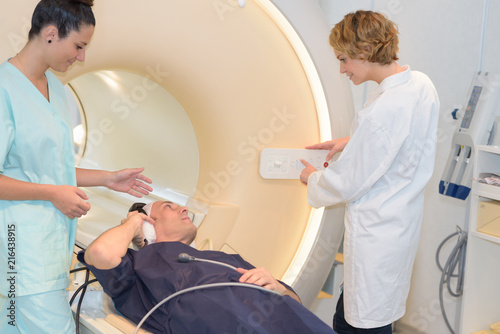 nurse and technican with patient for mri