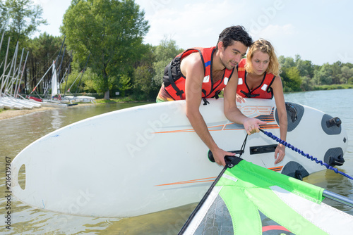 couple going windsurfing