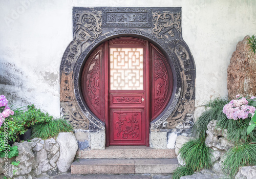 Photography Traditional chinese circular red door with wooden ornaments at Yu Gardens, Shang
